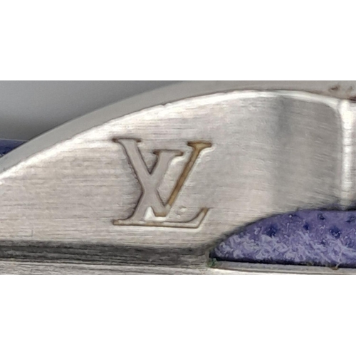 136 - A Vintage Louis Vuitton Blue Bifold Wallet. Epi leather exterior with silver-toned hardware and pres... 