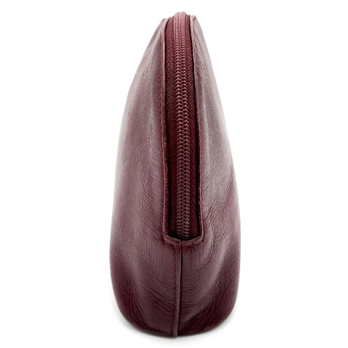 170 - A Vintage Cartier Burgundy Pouch. Leather exterior with zip top closure. Burgundy canvas interior. A... 