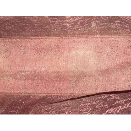 170 - A Vintage Cartier Burgundy Pouch. Leather exterior with zip top closure. Burgundy canvas interior. A... 