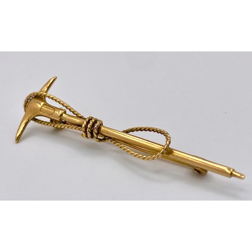 112 - A vintage, Swiss, 10 K yellow gold Mountaineering Ice Axe and Rope brooch. Traditionally these brooc... 