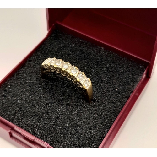 111 - 9 carat GOLD and DIAMOND RING. Having 7 x DIAMONDS  mounted to top with a fully hallmarked yellow GO... 