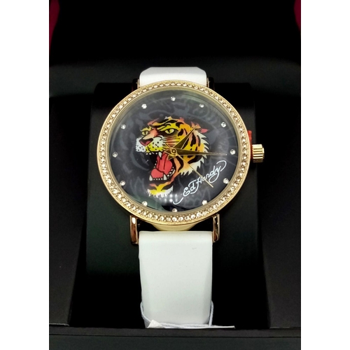 1373 - An Ed Hardy Ladies Quartz Watch. As new, in original packaging but needs a battery so as found.