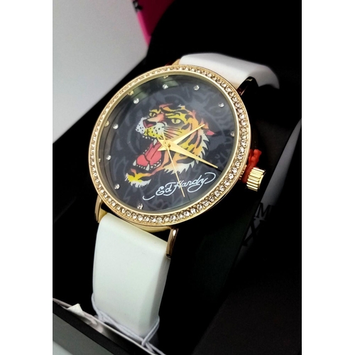 1373 - An Ed Hardy Ladies Quartz Watch. As new, in original packaging but needs a battery so as found.