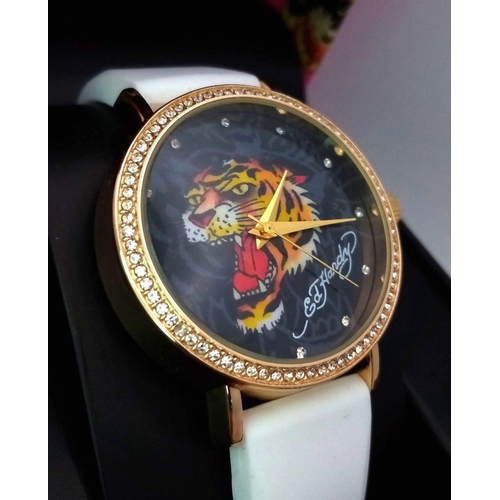 1373 - An Ed Hardy Ladies Quartz Watch. As new, in original packaging but needs a battery so as found.