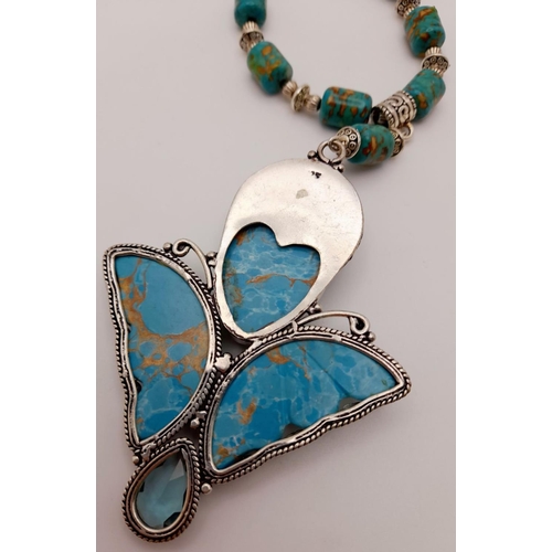 175 - A copper turquoise necklace with a large ART DECO silver pendant and accompanied by a bracelet and a... 