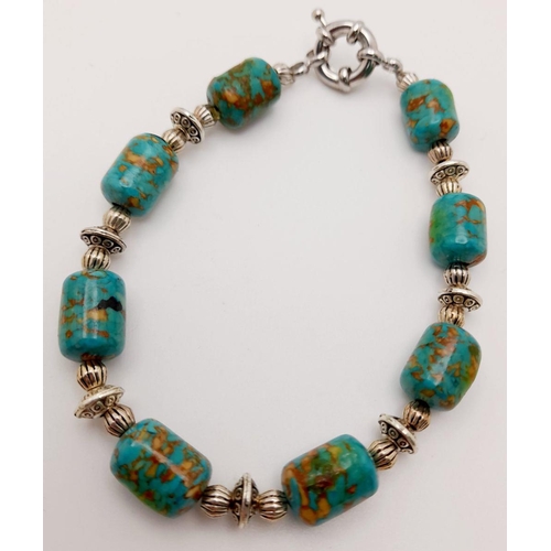 175 - A copper turquoise necklace with a large ART DECO silver pendant and accompanied by a bracelet and a... 