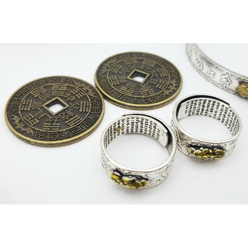 203 - A Feng Sui group of items:
Two bracelets with Chinese characters (his & hers)
Two rings with Chinese... 