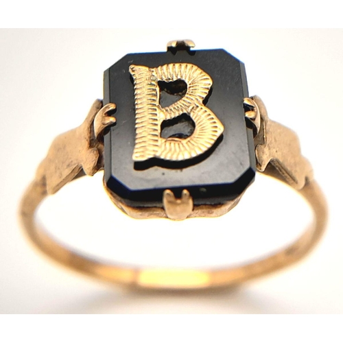 21 - 9 carat GOLD and BLACK ONYX RING. Having Initial ‘B’ set to top in 9 carat GOLD. 1.8 grams. Size N.