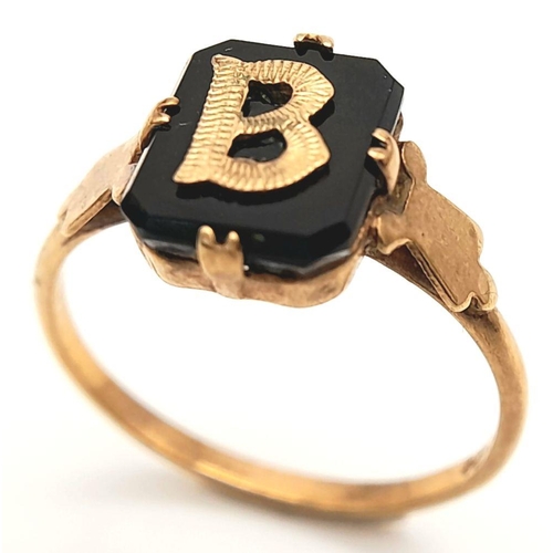 21 - 9 carat GOLD and BLACK ONYX RING. Having Initial ‘B’ set to top in 9 carat GOLD. 1.8 grams. Size N.