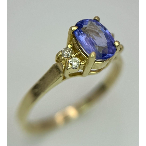 214 - A 14K YELLOW GOLD DIAMOND & TANZANITE RING - 1.9G. SIZE L