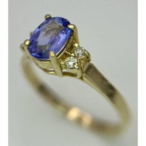 214 - A 14K YELLOW GOLD DIAMOND & TANZANITE RING - 1.9G. SIZE L