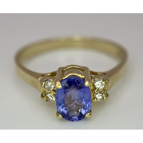 214 - A 14K YELLOW GOLD DIAMOND & TANZANITE RING - 1.9G. SIZE L