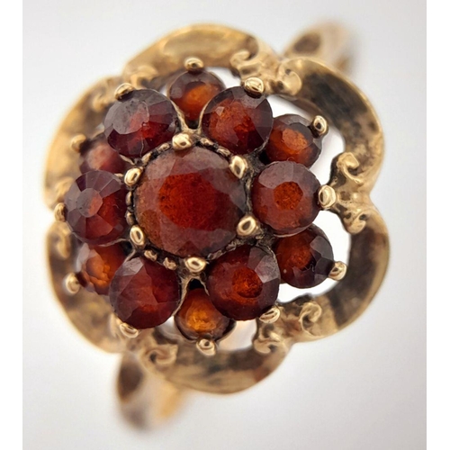 216 - Vintage 9 carat GOLD,GARNET CLUSTER RING with lovely GOLD COLLAR SURROUND.Full UK hallmark.Complete ... 