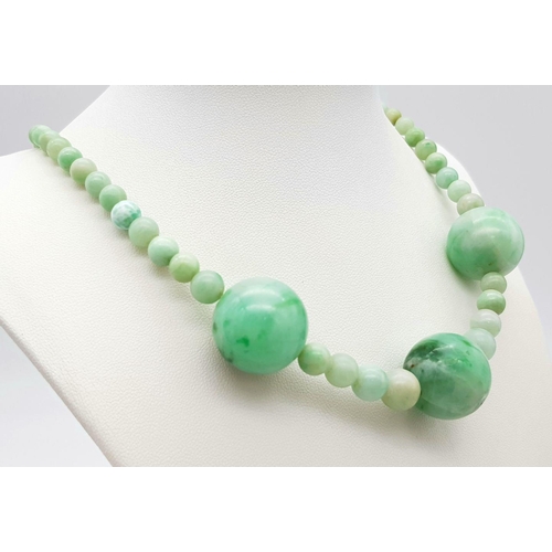 344 - A Vintage Light Green Jade Graduated Bead Necklace. 20mm largest beads. 40cm necklace length.