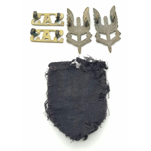 349 - WW2 British Middle Eastern Made Sand Cast SAS shoulder titles, Collar Badges and cloth Cap Badge.