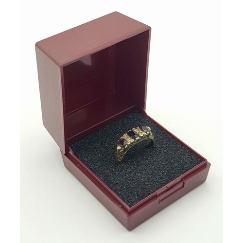 35 - 9 carat GOLD GARNET and DIAMOND RING. UK Hallmark. Complete with the ring box. 2.9 grams. Size M 1/2... 