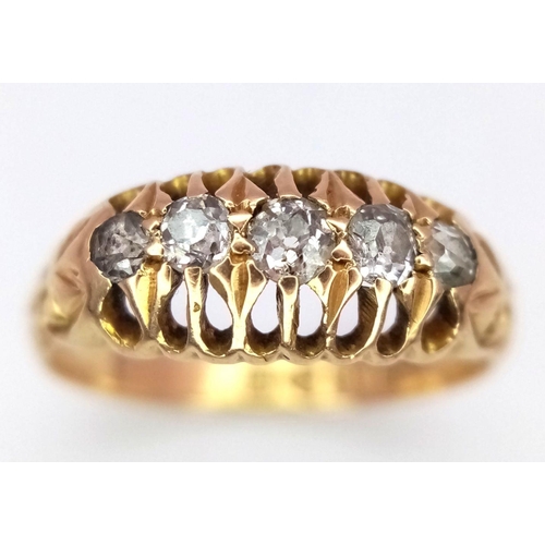 358 - An 18K Yellow Gold Five Stone Diamond Ring. Pierced decoration. Chester hallmarks. Size K. 2.6g tota... 