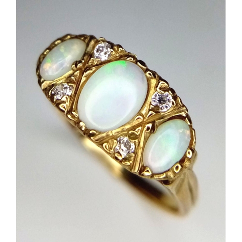 365 - A Vintage 9K Yellow Gold Three Opal and Diamond Ring. Three opal cabochons with excellent colour-pla... 