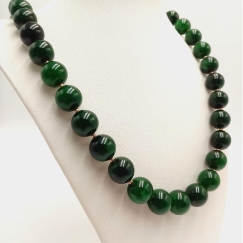 380 - A Beautiful Rich Dark Green Jade Bead Necklace with Gold Clasp. 14mm beads. 55cm length