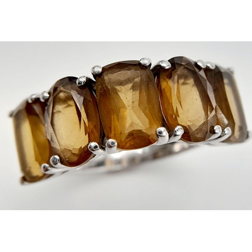 392 - Impressive SILVER and  SMOKY QUARTZ RING. Consisting five nicely cut gemstones set to top in SILVER ... 