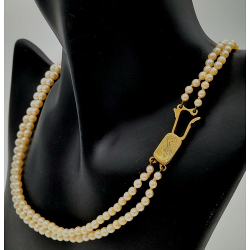 408 - A Vintage Two Row Graduated Pearl Necklace with a 9K Gold Clasp. 42cm