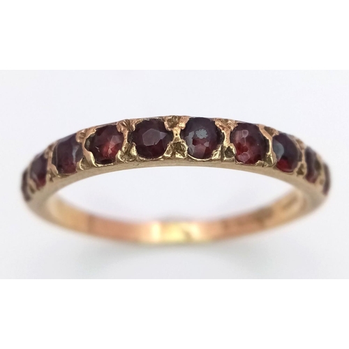 476 - Impressive 9 carat GOLD and GARNET RING.Full Hallmark with 10 x GARNETS set to top.2 grams. Size T.