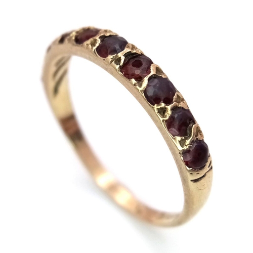 476 - Impressive 9 carat GOLD and GARNET RING.Full Hallmark with 10 x GARNETS set to top.2 grams. Size T.