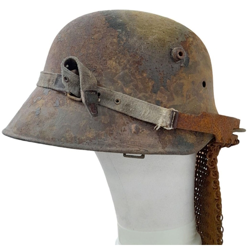 55 - WW1 German “Splitterschutz” Heavy machine gunners veil and helmet.