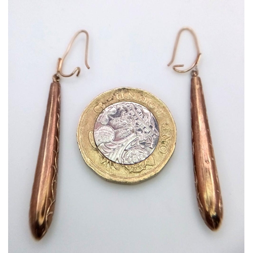 70 - 9 carat GOLD  DROP EARRINGS. Baton shape with lovely chased pattern. Please see pictures. 1.4 grams.