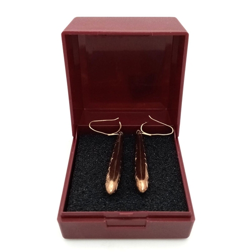 70 - 9 carat GOLD  DROP EARRINGS. Baton shape with lovely chased pattern. Please see pictures. 1.4 grams.