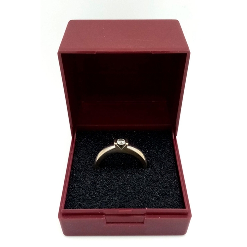 77 - 18 carat WHITE GOLD and DIAMOND SOLITAIRE RING. Having a .15 carat DIAMOND mounted to top in contras... 