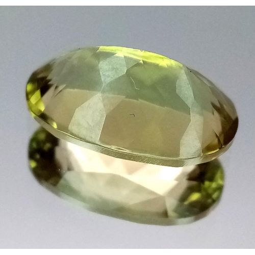 128 - A GIA CERTIFIED DIASPORE GEMSTONE - 6.16CT. OVAL CUT