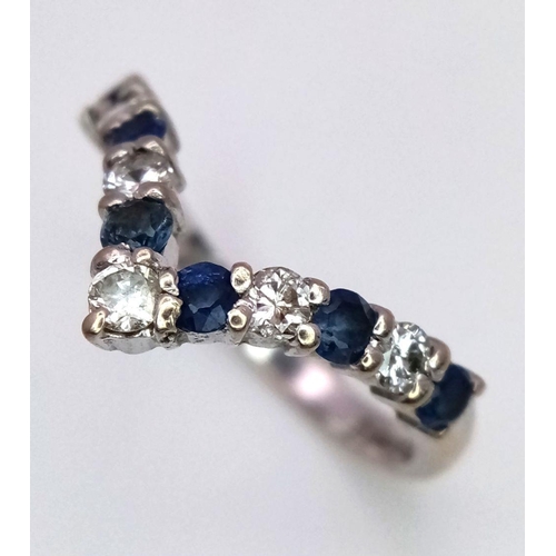 158 - AN 18K WHITE GOLD DIAMOND & SAPPHIRE SET WISHBONE RING - 3.2G. SIZE N. 0.15CT DIAMONDS & 0.25CT SAPP... 