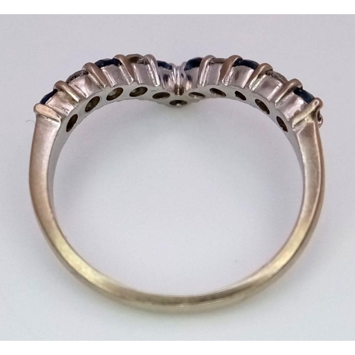 158 - AN 18K WHITE GOLD DIAMOND & SAPPHIRE SET WISHBONE RING - 3.2G. SIZE N. 0.15CT DIAMONDS & 0.25CT SAPP... 