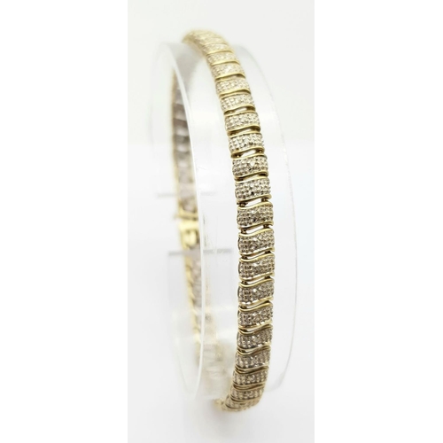 179 - A 9K YELLOW GOLD DIAMOND SET BRACELET - 7.6G.