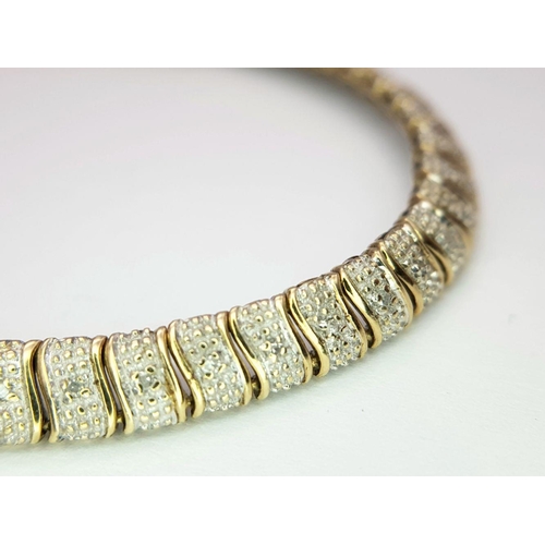 179 - A 9K YELLOW GOLD DIAMOND SET BRACELET - 7.6G.