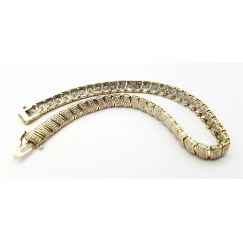 179 - A 9K YELLOW GOLD DIAMOND SET BRACELET - 7.6G.