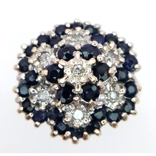 193 - A 9K YELLOW GOLD DIAMOND & SAPPHIRE CLUSTER RING 5.3G SIZE Q.

SC 1084