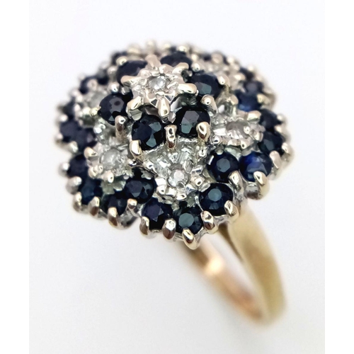 193 - A 9K YELLOW GOLD DIAMOND & SAPPHIRE CLUSTER RING 5.3G SIZE Q.

SC 1084