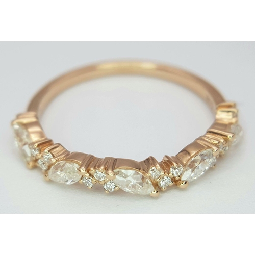 207 - A 14K ROSE GOLD DIAMOND BAND RING - MARQUISE & ROUND BRILLIANT CUT DIAMONDS. 0.45CT. 1.3G. SIZE K.