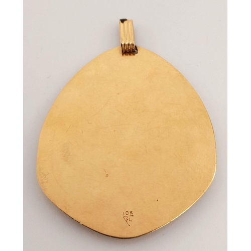 248 - A 10k stamped yellow gold large libra scales pendant. 10.5g. Approximately 5cm by 4cm.