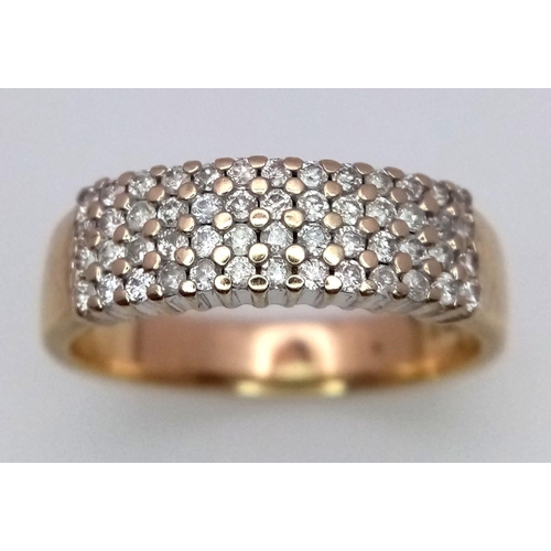 257 - A 9K YELLOW GOLD 4 ROW DIAMOND BAND RING - 0.50CT. 3.3G. SIZE Q