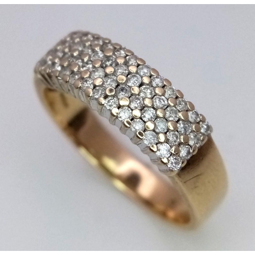 257 - A 9K YELLOW GOLD 4 ROW DIAMOND BAND RING - 0.50CT. 3.3G. SIZE Q