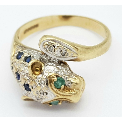 264 - A 9K YELLOW GOLD DIAMOND, SAPPHIRE & EMERALD SET PANTHER RING - 5G. SIZE R.