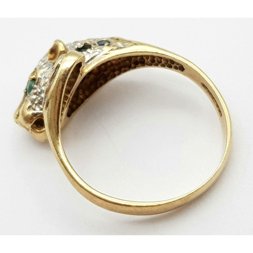 264 - A 9K YELLOW GOLD DIAMOND, SAPPHIRE & EMERALD SET PANTHER RING - 5G. SIZE R.