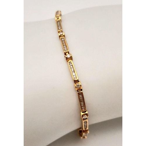 292 - A 18K YELLOW GOLD DIAMOND BRACELET SET WITH BAGUETTES & ROUND BRILLIANT CUTS DIAMOND . 0.90CT , 4.3G... 