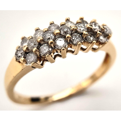 397 - A 9K YELLOW GOLD 3 ROW DIAMOND RING. 0.50CT. 2G. SIZE N.