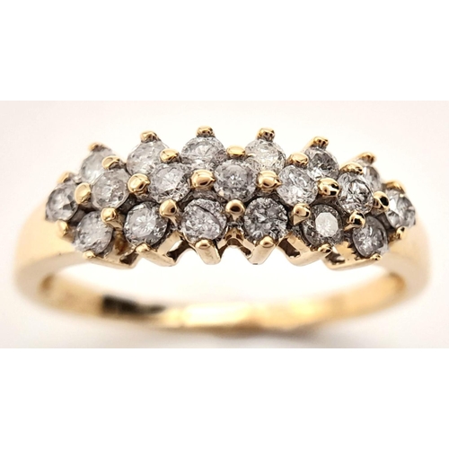 397 - A 9K YELLOW GOLD 3 ROW DIAMOND RING. 0.50CT. 2G. SIZE N.