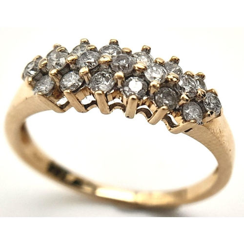 397 - A 9K YELLOW GOLD 3 ROW DIAMOND RING. 0.50CT. 2G. SIZE N.