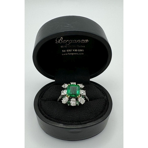 4 - A Stunning Emerald and Diamond Ring. Emerald cut centre emerald - 2.5ct with an emerald -0.8ctw and ... 